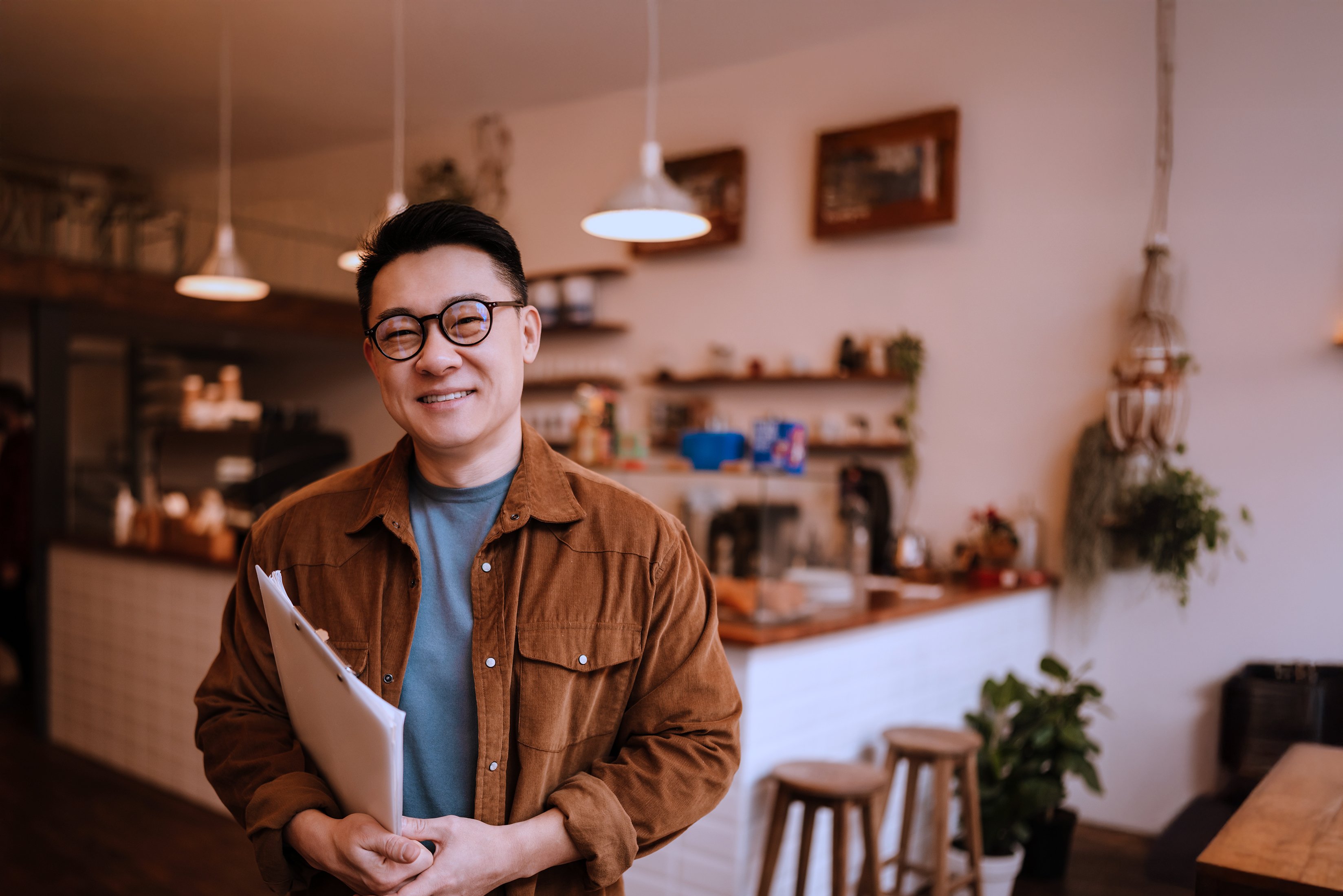 Asian man cafe owner